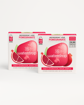 Two pink Waterdrop hydration cube boxes with a pomegranate graphic on a white background.