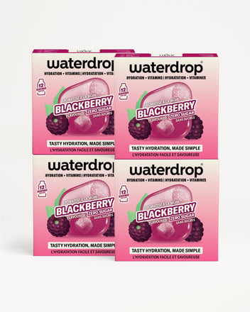 Four pink Waterdrop packaging boxes with blackberry imagery arranged in a 2x2 grid.