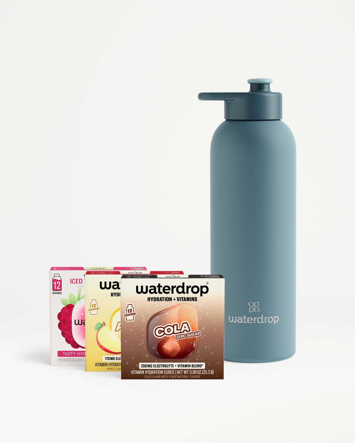 Blue reusable water bottle with a pump-top spout beside a set of flavor packet boxes.