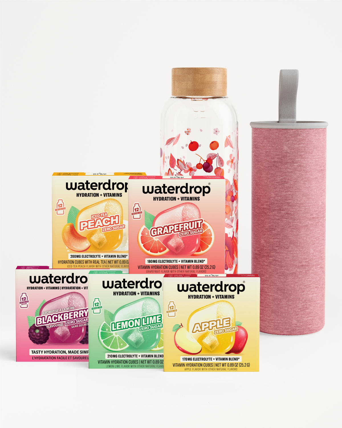 Assorted vitamin hydration drink mix boxes with a glass bottle and a pink insulated water bottle.
