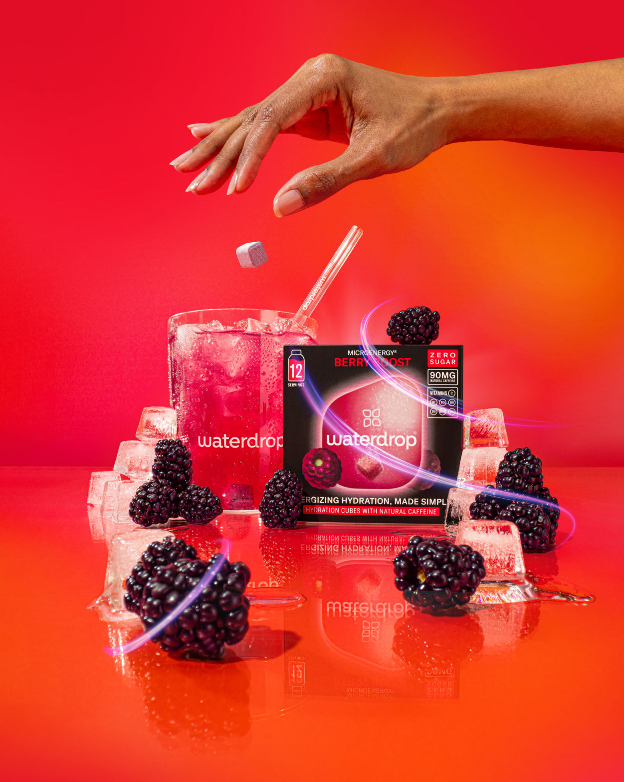 BERRY BOOST hydration cube dropping into branded glass.