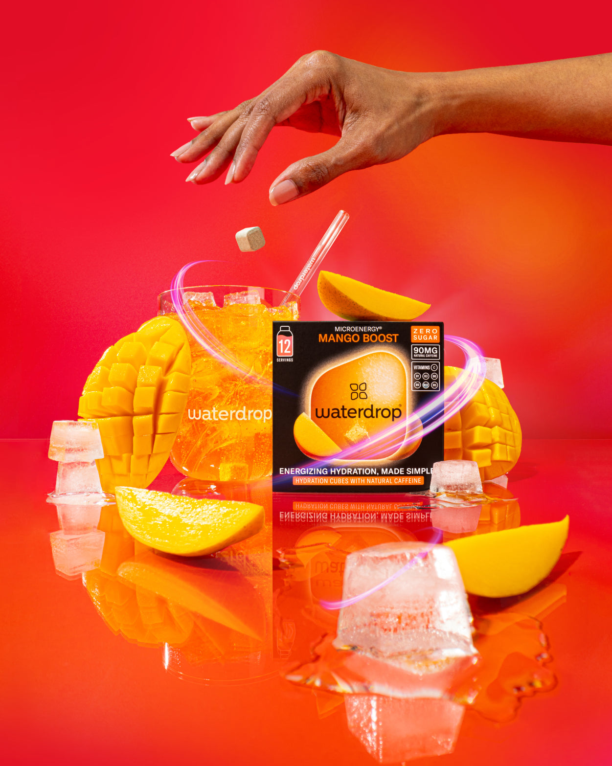 MANGO BOOST hydration cubes with mango, glass, and packaging.