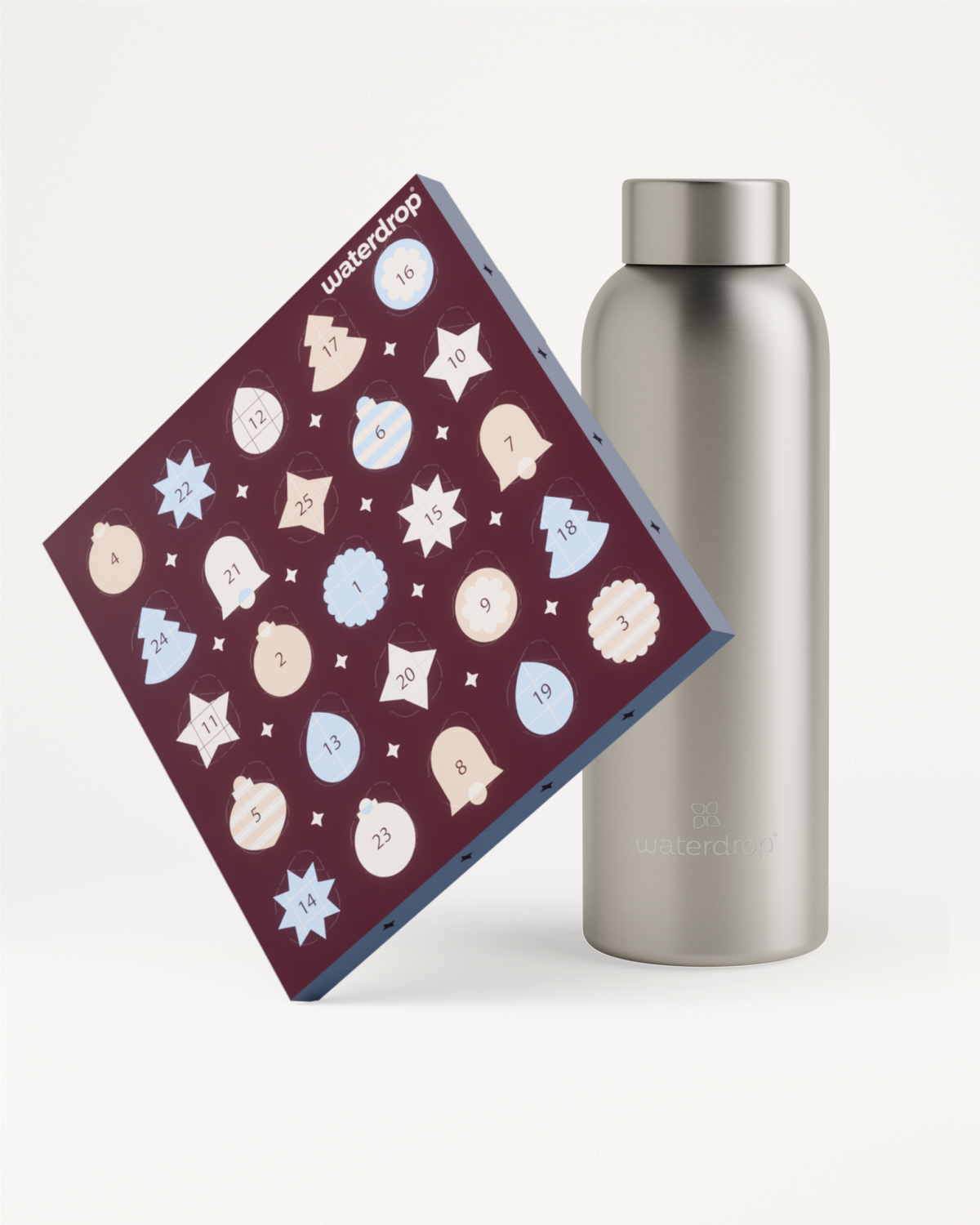 Purple Advent calendar with circular icons leaning beside a stainless steel water bottle.