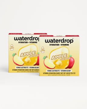 Two boxes of apple-flavored hydration and vitamins drink mix.