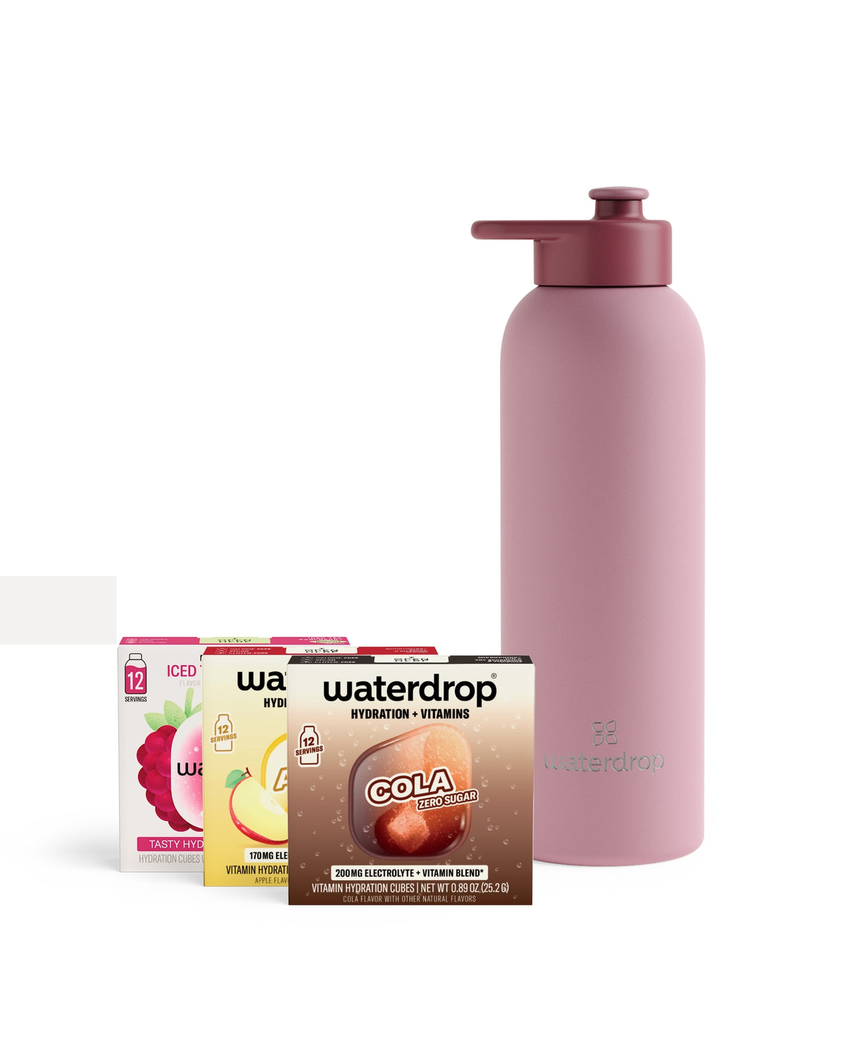 Pink reusable water bottle with a pump cap beside assorted vitamin drink mix sachets.