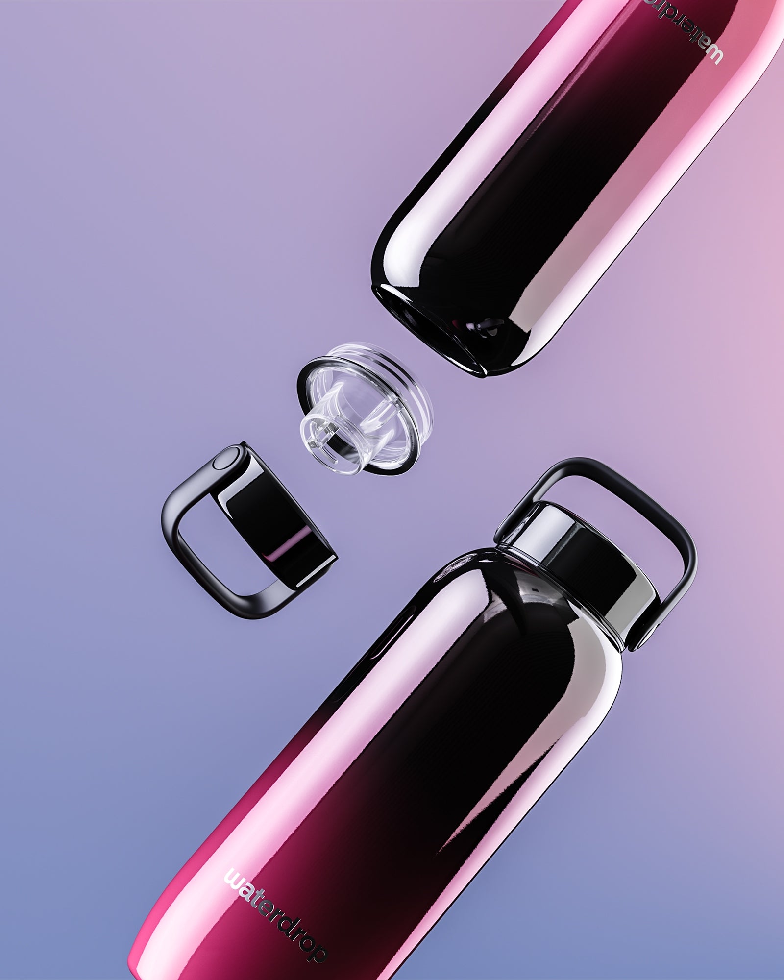 Two gradient pink and purple stainless steel water bottles with caps removed, arranged diagonally.