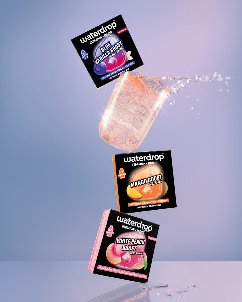 Floating Waterdrop Boost sachets stacked mid-air against a blue gradient background.