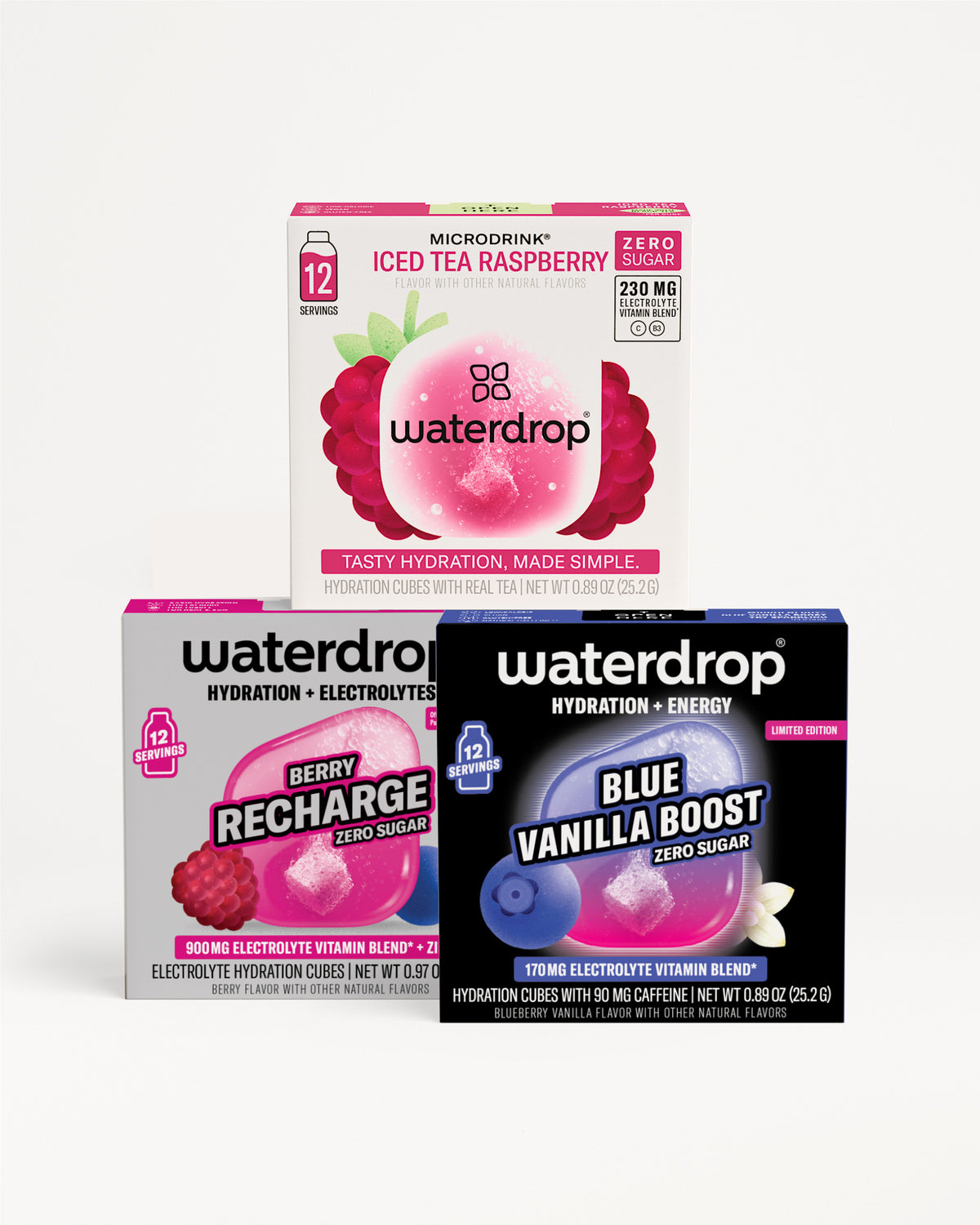 Three Waterdrop hydration electrolyte boxes stacked, with Iced Tea Raspberry on top, Berry Recharge and Blue Vanilla Boost on the bottom.