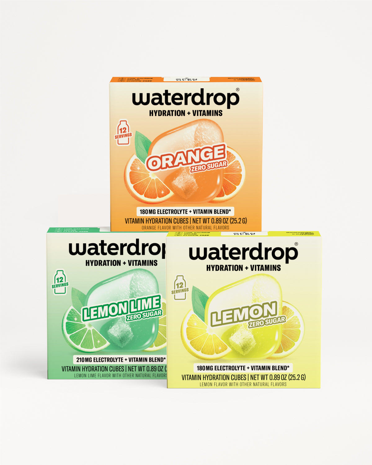 Three Waterdrop hydration and vitamin blend boxes in orange, lemon lime, and lemon flavors stacked together.