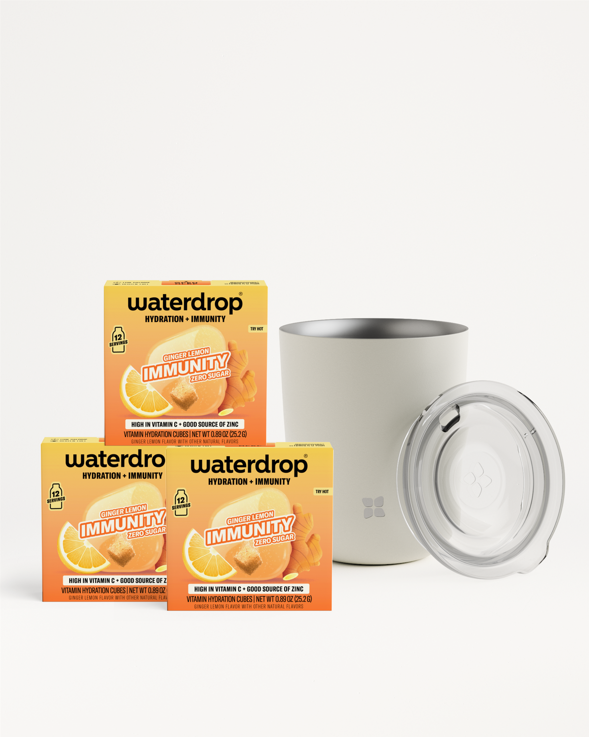 Three orange boxes of hydration product and a white tumbler with a clear lid.