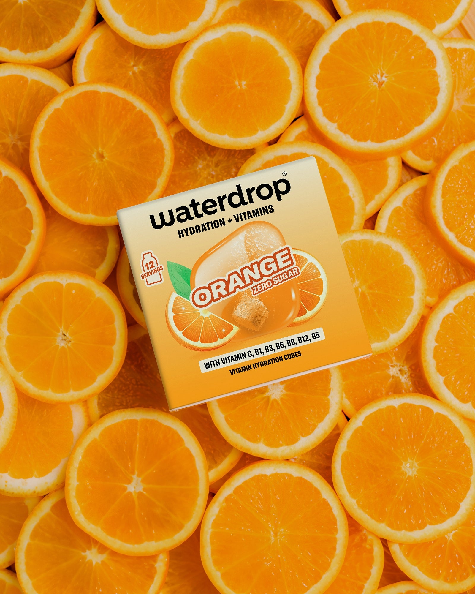 Surface densely packed with orange halves, with a small white square box in the center.