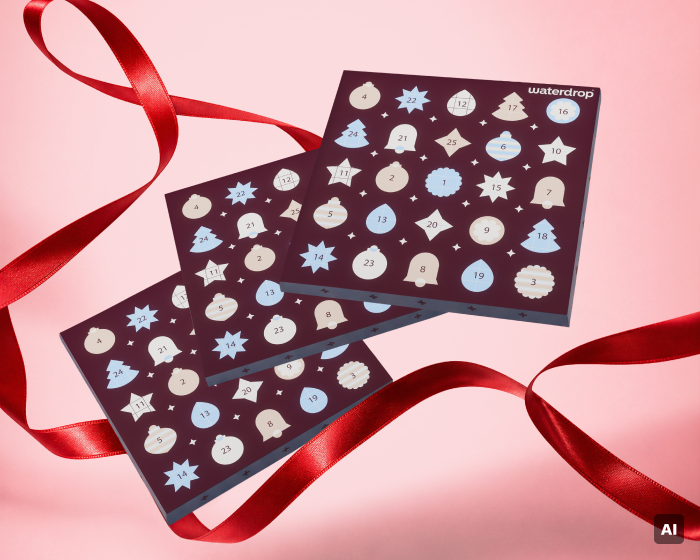 Two navy advent calendar boards with numbered circular windows and holiday shapes on a pink background with red ribbons.